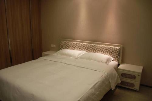 Imagen general del Xinyang City Celebrity Apartment. Foto 7