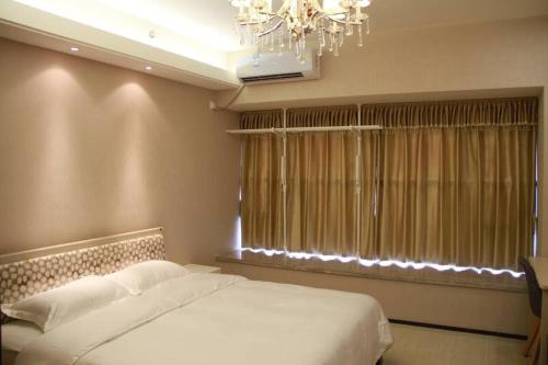 Imagen general del Xinyang City Celebrity Apartment. Foto 8