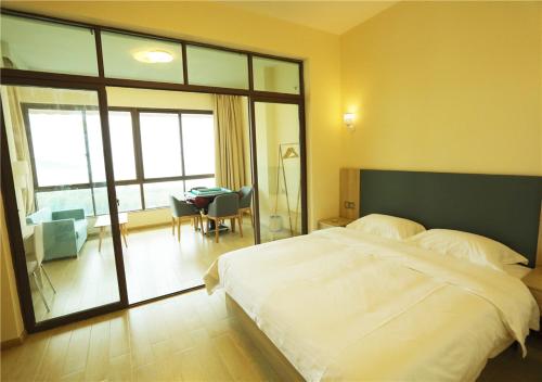 Imagen de la habitación del Xuliao Bay Cuihai Bay Aparthotel. Foto 9