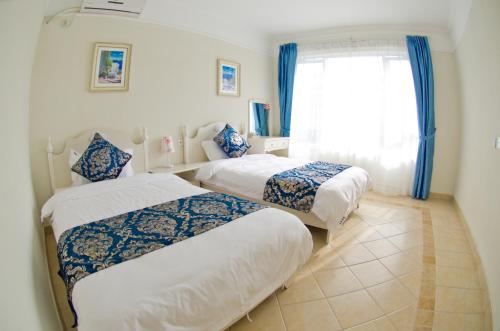 Imagen de la habitación del Xunliao Bay Meitu Hotel. Foto 5