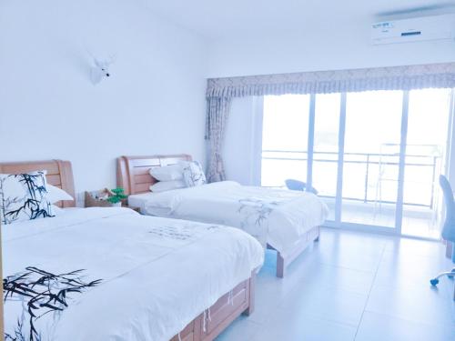 Imagen de la habitación del Xunliao Bay Sea Park Holiday Hotel. Foto 6