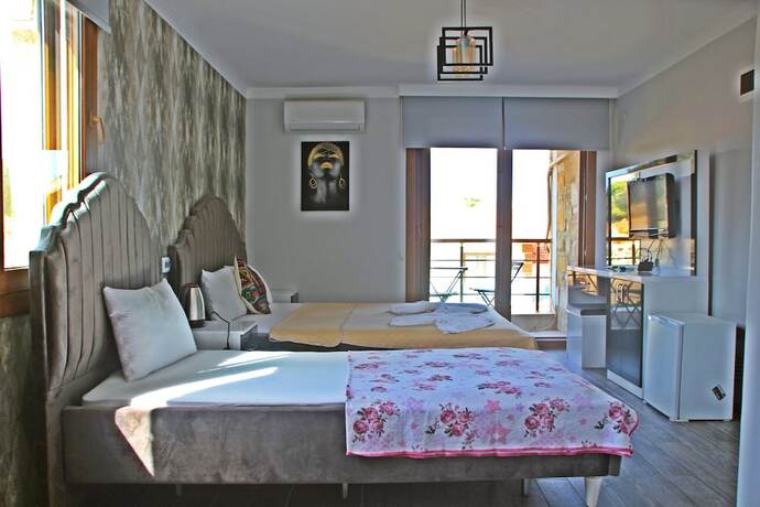 Imagen de la habitación del Yeni Foca Butik Otel. Foto 17