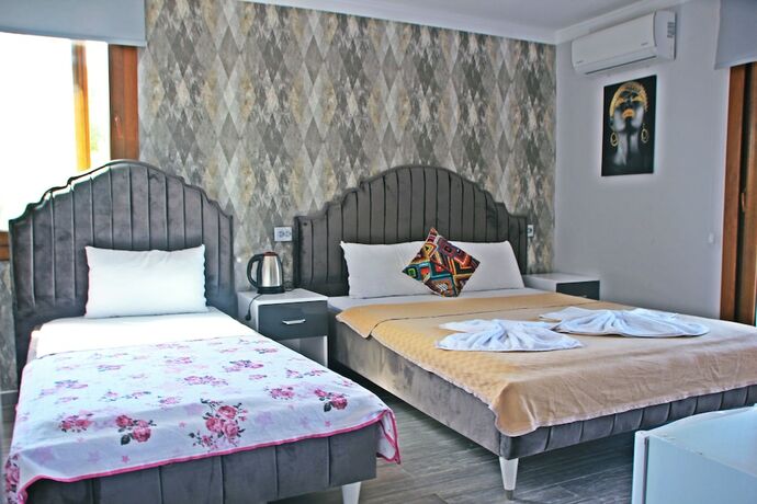 Imagen de la habitación del Yeni Foca Butik Otel. Foto 19