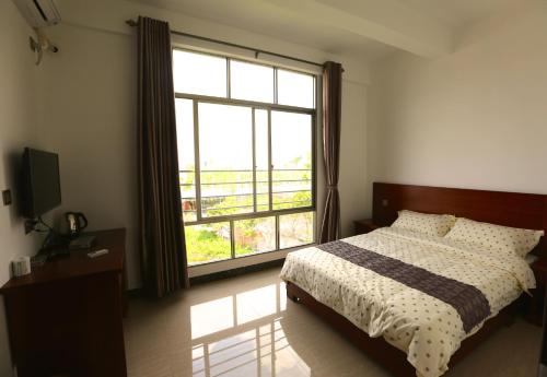 Imagen de la habitación del Yintan Fishing Village In Beihai. Foto 8