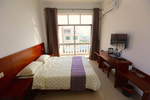 Imagen de la habitación del Yintan Fishing Village In Beihai. Foto 9