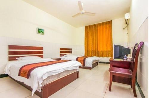 Imagen de la habitación del Yongxing Inn. Foto 2