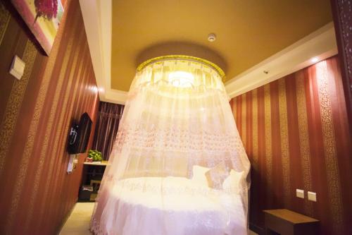 Imagen de la habitación del Yueting Apartment Dalian. Foto 10