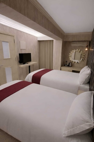 Imagen de la habitación del ZEBRA OTEL BUCA. Foto 11