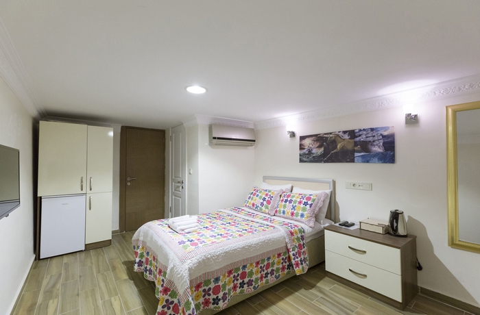 Imagen de la habitación del Zendy Suite Hotel. Foto 2