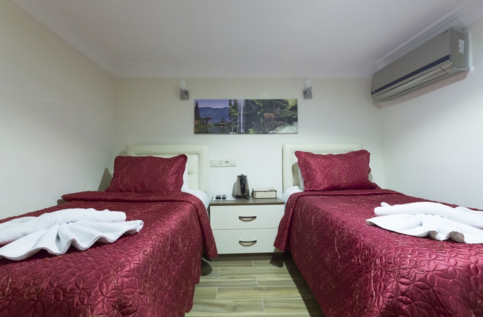 Imagen de la habitación del Zendy Suite Hotel. Foto 3