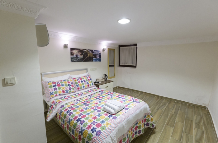 Imagen de la habitación del Zendy Suite Hotel. Foto 7