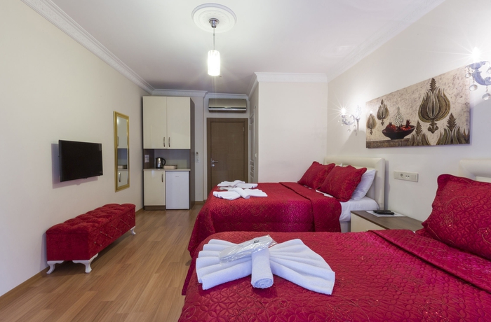 Imagen de la habitación del Zendy Suite Hotel. Foto 8