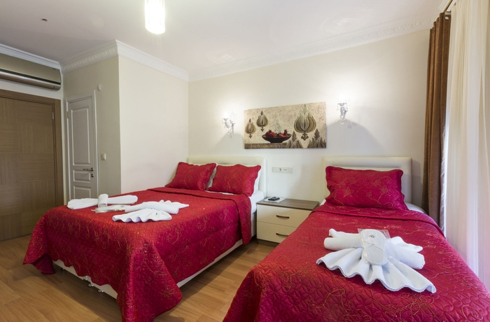 Imagen de la habitación del Zendy Suite Hotel. Foto 9