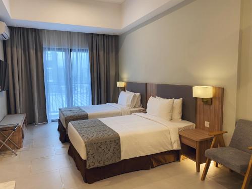 Imagen de la habitación del Zenith Suites Cameron. Foto 18