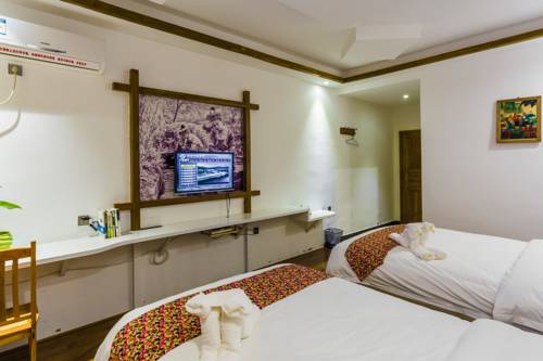 Imagen de la habitación del Zhangjiajie Jijiehao Inn. Foto 3