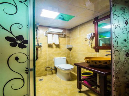 Imagen de la habitación del Zhangjiajie Yijia Inn. Foto 5