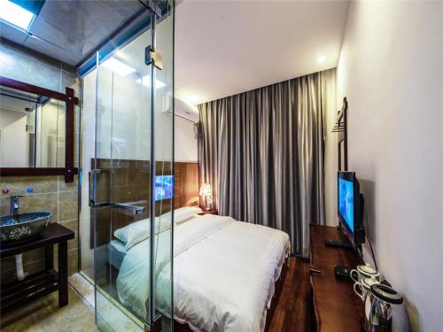 Imagen de la habitación del Zhangjiajie Yijia Inn. Foto 6