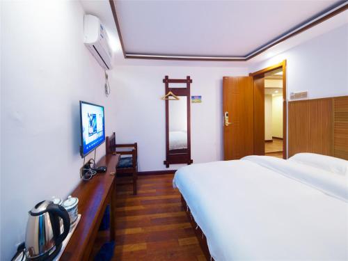 Imagen de la habitación del Zhangjiajie Yijia Inn. Foto 7