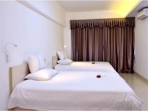 Imagen de la habitación del Zhongshan Xinghui International Apartment. Foto 8