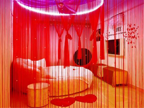 Imagen de la habitación del Zhongshan Xinghui International Apartment. Foto 9