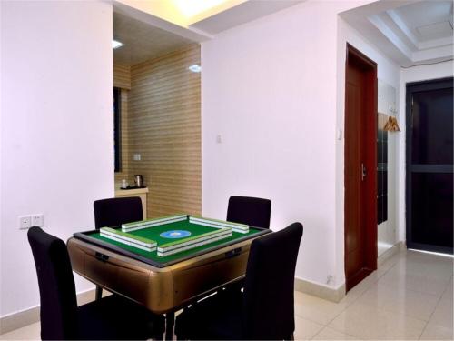 Imagen de la habitación del Zhongshan Xinghui International Apartment. Foto 10