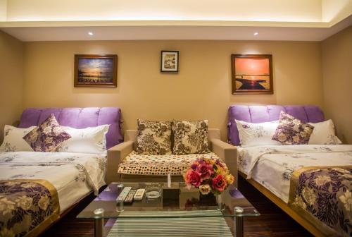 Imagen de la habitación del Zixinju Aparthotel. Foto 6
