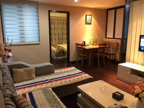Imagen de la habitación del Zixinju Aparthotel. Foto 8