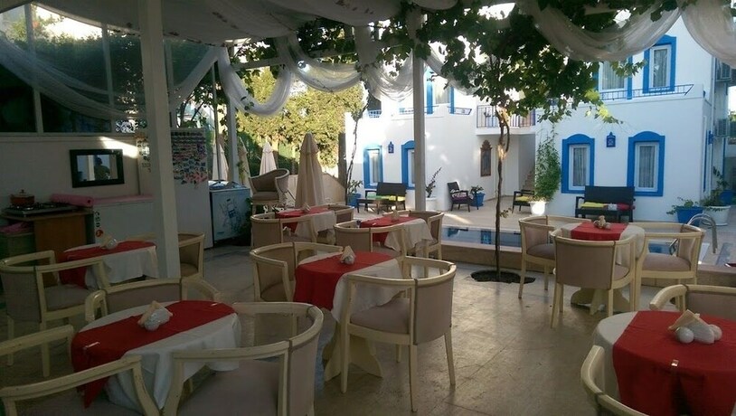 Imagen del bar/restaurante del Zuzu's Kitchen and Apartments. Foto 15