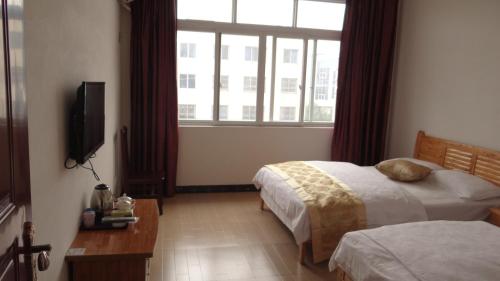 Imagen general del e&lsquo;meishan jintong inn. Foto 4