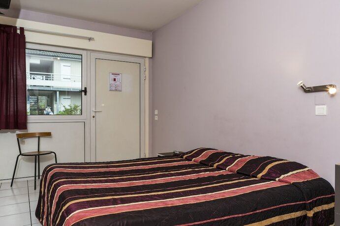 Imagen de la habitación del inital by balladins Lyon Chanas. Foto 14