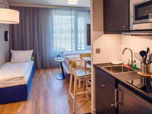 Imagen de la habitación del Apartahotel Adagio Access Stuttgart Airport Messe. Foto 16