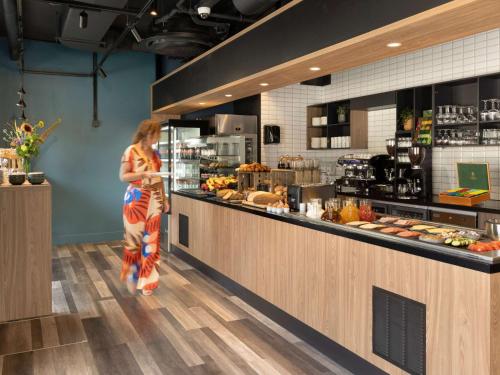 Imagen del bar/restaurante del Apartahotel Adagio Antwerp City Center. Foto 17