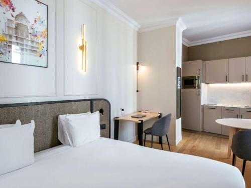 Imagen de la habitación del Apartahotel Adagio Paris Opera. Foto 20