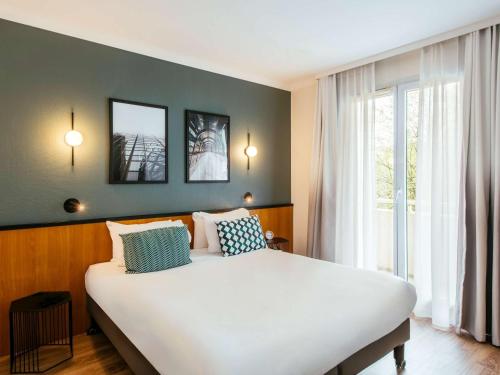 Imagen de la habitación del Apartahotel Adagio la Defense-Le Parc. Foto 13