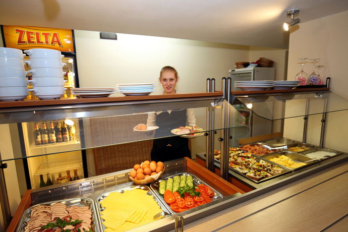 Imagen del bar/restaurante del Apartahotel Apart Hotel Tomo. Foto 7