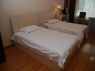 Imagen de la habitación del Apartahotel Central Dalian. Foto 4
