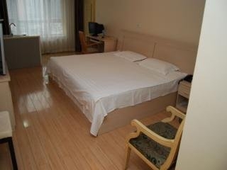 Imagen de la habitación del Apartahotel Central Dalian. Foto 7