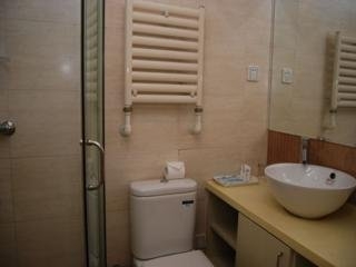 Imagen de la habitación del Apartahotel Central Dalian. Foto 8