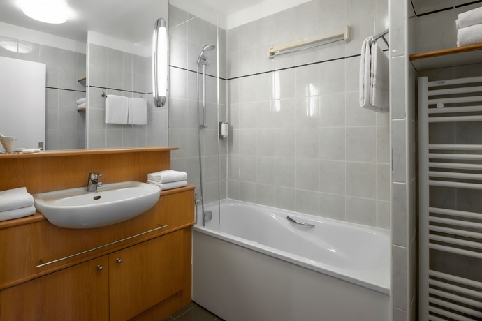 Imagen de la habitación del Apartahotel Citadines Bastille Marais Paris. Foto 12