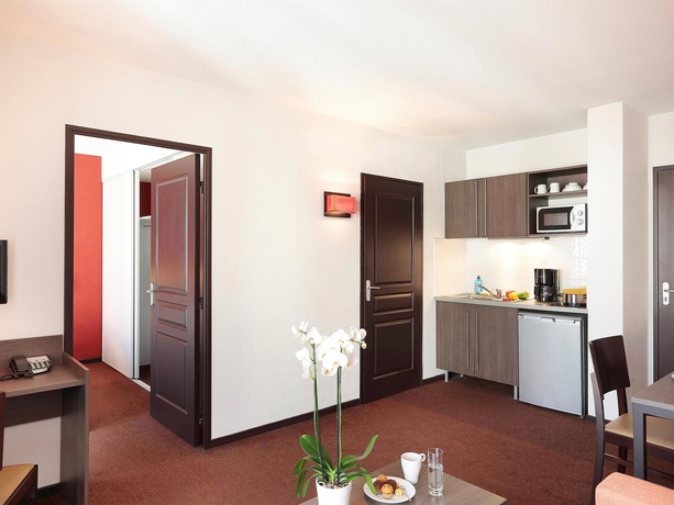 Imagen de la habitación del Apartahotel Comfort Aparthotel Nîmes Centre. Foto 13