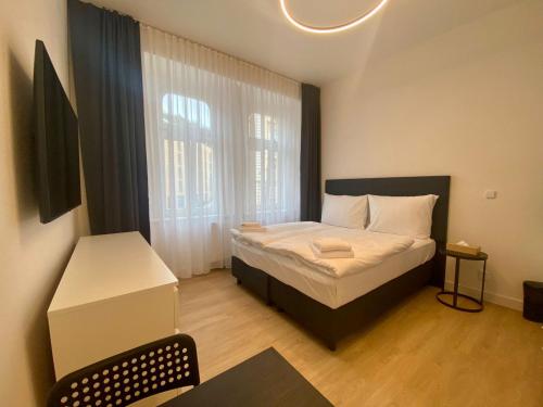 Imagen de la habitación del Apartahotel Figaro Suites. Foto 5