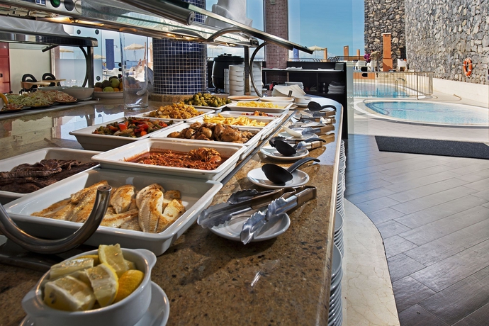 Imagen del bar/restaurante del Apartahotel Kn Panoramica Heights. Foto 3