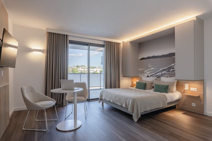 Imagen de la habitación del Apartahotel Lagrange Apart'hotel Les Jardins D'olympie. Foto 10