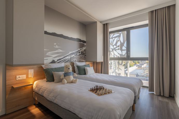 Imagen de la habitación del Apartahotel Lagrange Apart'hotel Les Jardins D'olympie. Foto 16