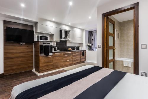 Imagen de la habitación del Apartahotel Livin' Serviced Apartments. Foto 7