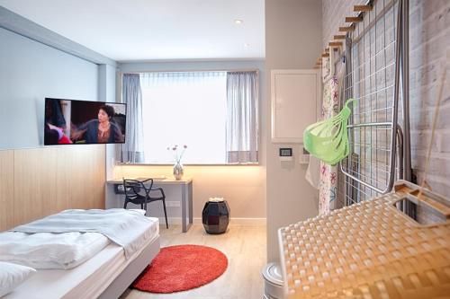 Imagen de la habitación del Apartahotel Mloft Apartments München. Foto 2
