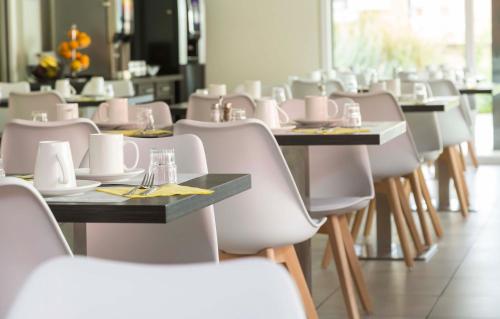 Imagen del bar/restaurante del Apartahotel Odalys City Colmar La Rose D'argent. Foto 2