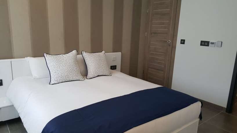 Imagen de la habitación del Apartahotel Pebbles Boutique. Foto 11