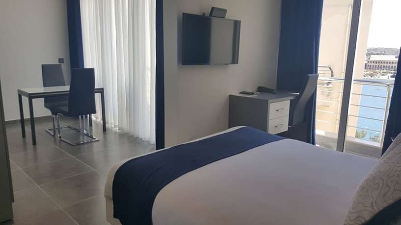 Imagen de la habitación del Apartahotel Pebbles Boutique. Foto 14