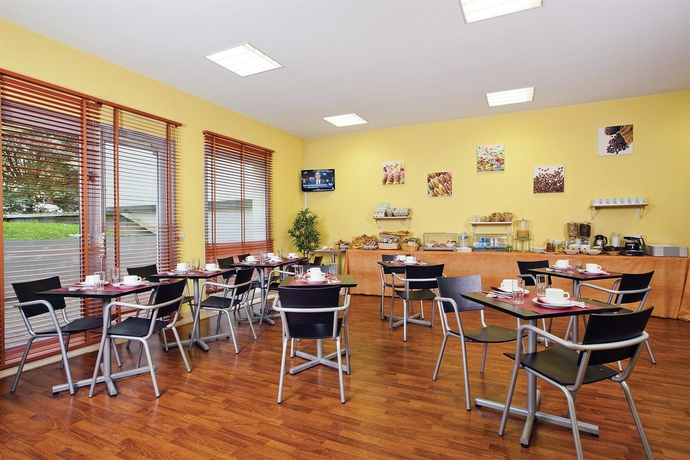 Imagen del bar/restaurante del Apartahotel Séjours and Affaires Lyon Park Lane. Foto 3